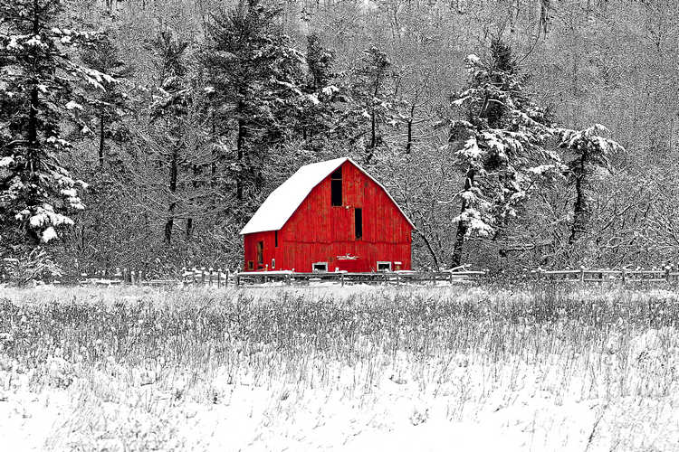 Red barn in snow-covered landscape