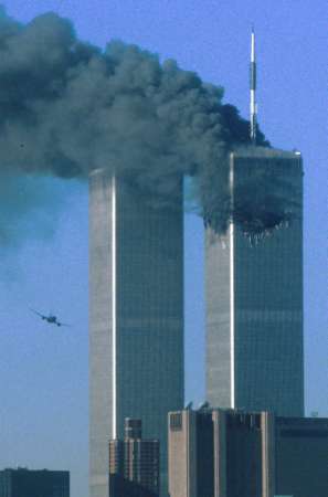 WTC Tower 1 on fire as flight UA175 approaches