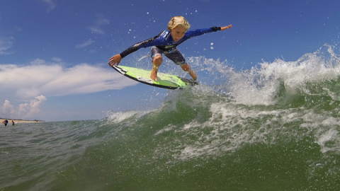 A grom riding wave