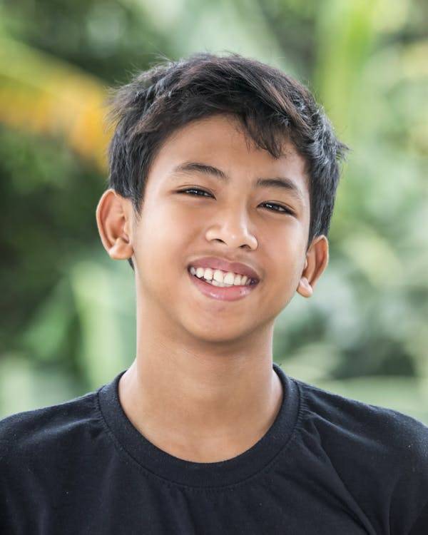 Head and shoulders image of smiling teenage boy