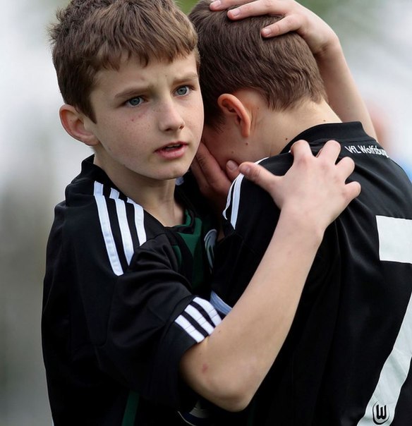 Two boys embracing