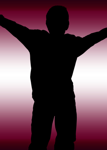 Silhouette of boy with outstretched arms