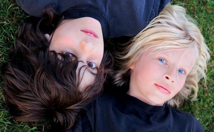 Two boys lying on the ground