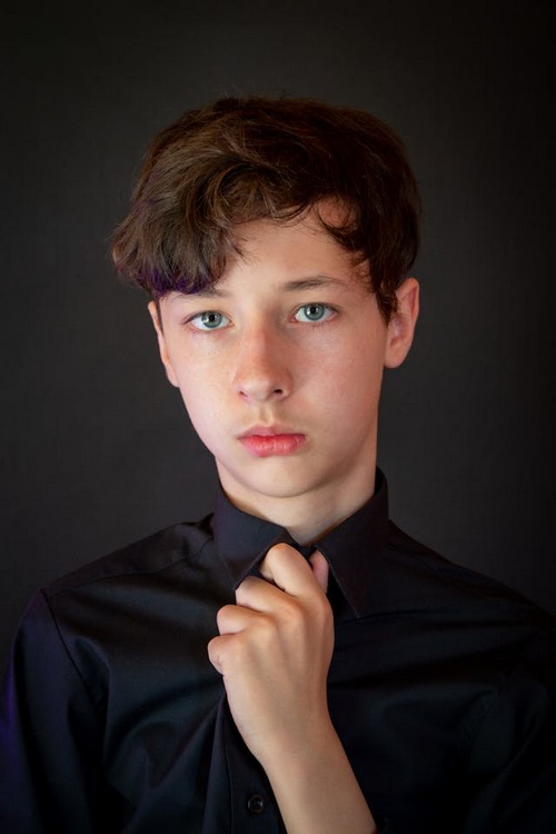 Teen boy looking concerned