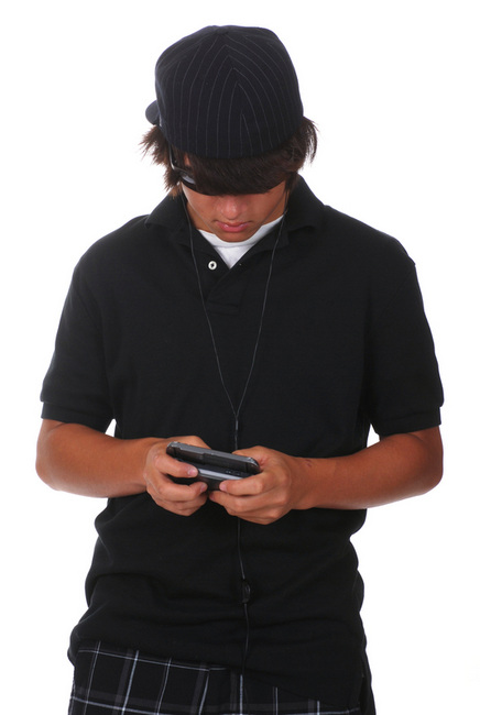 Boy texting on mobile phone
