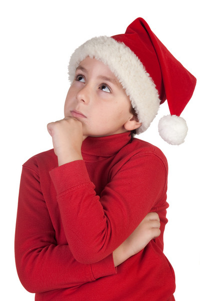 Boy in Christmas hat thinking