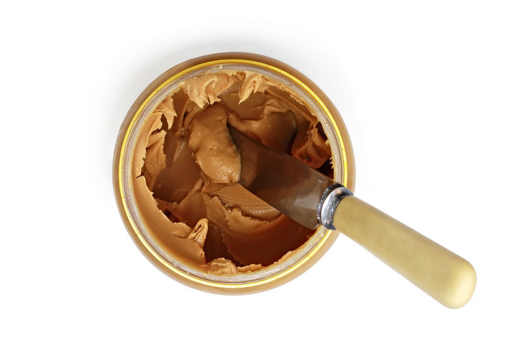 Jar of peanut butter and knife