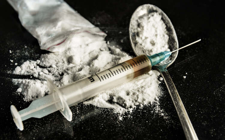 Drug syringe and heroin