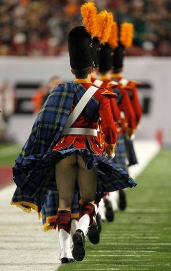 Soldier from behind, with the wind lifting his kilt
