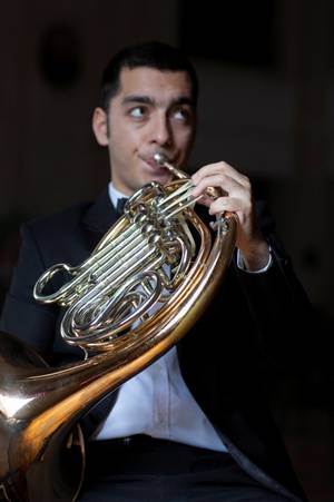 Man playing a French horn
