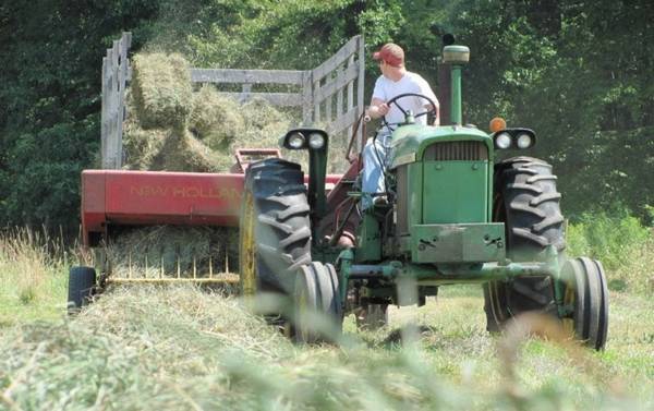 Man baling hay