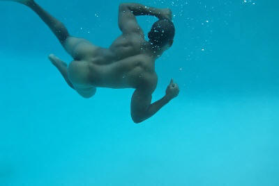 Nude man swimmimng underwater