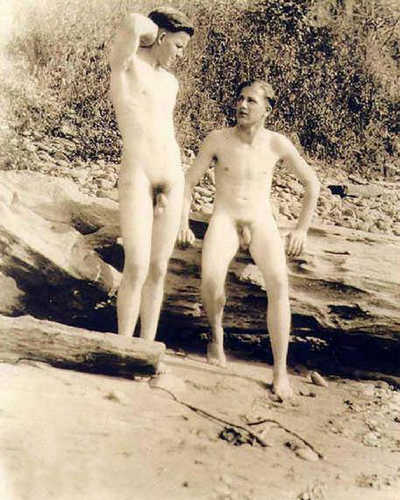 Two nude men on a beach