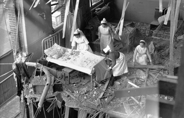 Nurses in a bomb-damaged hospital ward