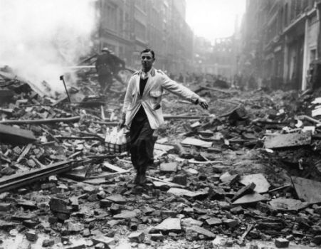 A milkman doing his rounds in a rubble-strewn street