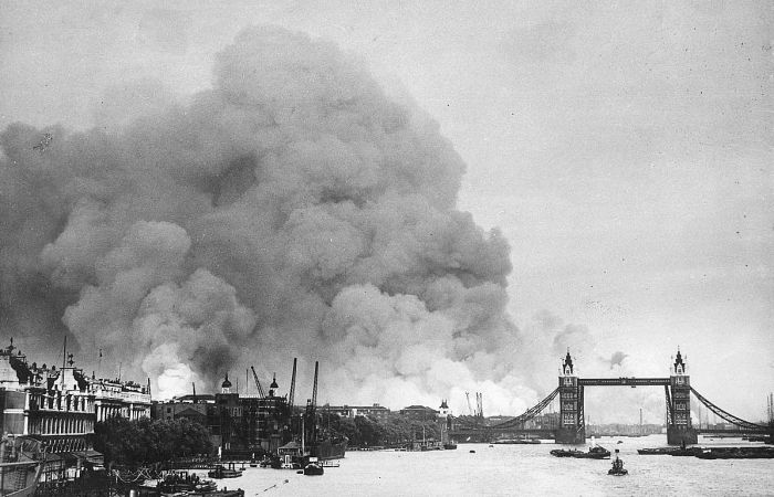Smoke billows up behind Tower Bridge