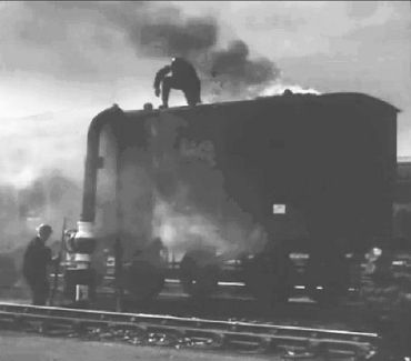 Putting out a fire on top of a train van