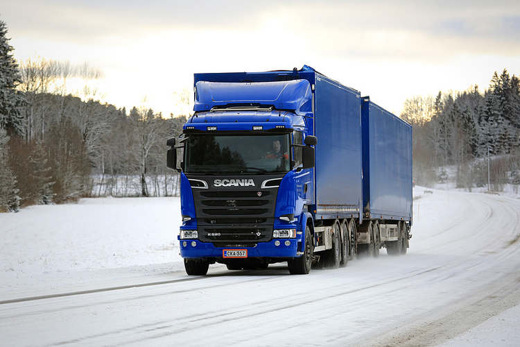 Big rig travelling on snow-covered road