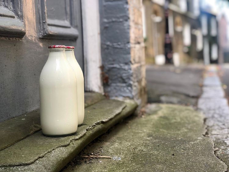 Milk bottles at front door